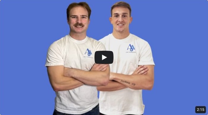 Alex Vislosky and Antonio George in white shirts, arms crossed